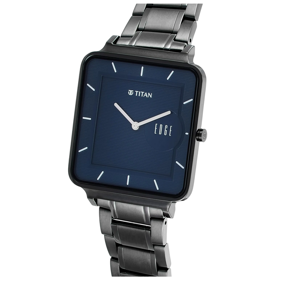 Titan watch with silver strap and blue face on a white background